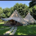 The Norwegian giant hat tipis set up for a wedding ceremony